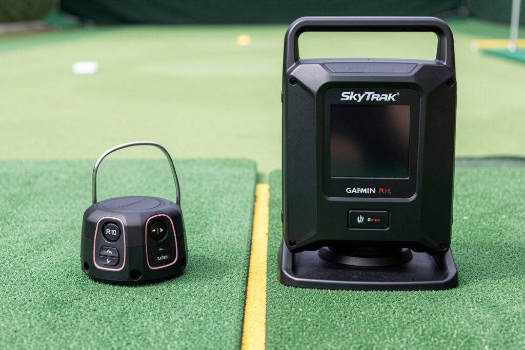 Garmin R10 radar monitor beside a SkyTrak Plus photometric monitor