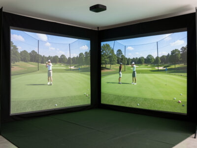 GSPro and E6 Connect course renders compared on a home sim screen
