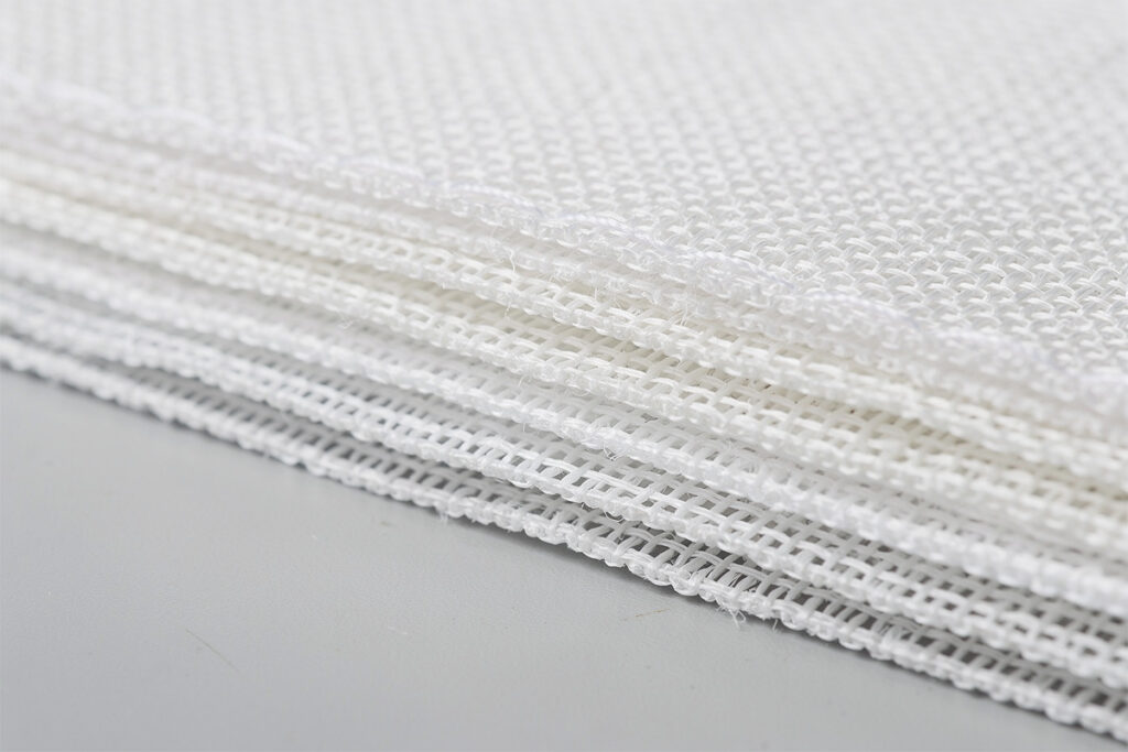 Multi-layer woven polyester golf impact screen material close-up