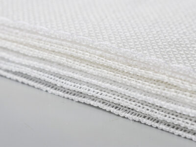 Multi-layer woven polyester golf impact screen material close-up