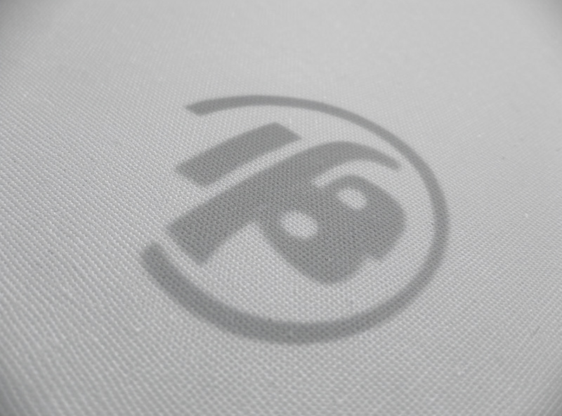 Taut multi-layer golf impact screen surface with a faint projected image