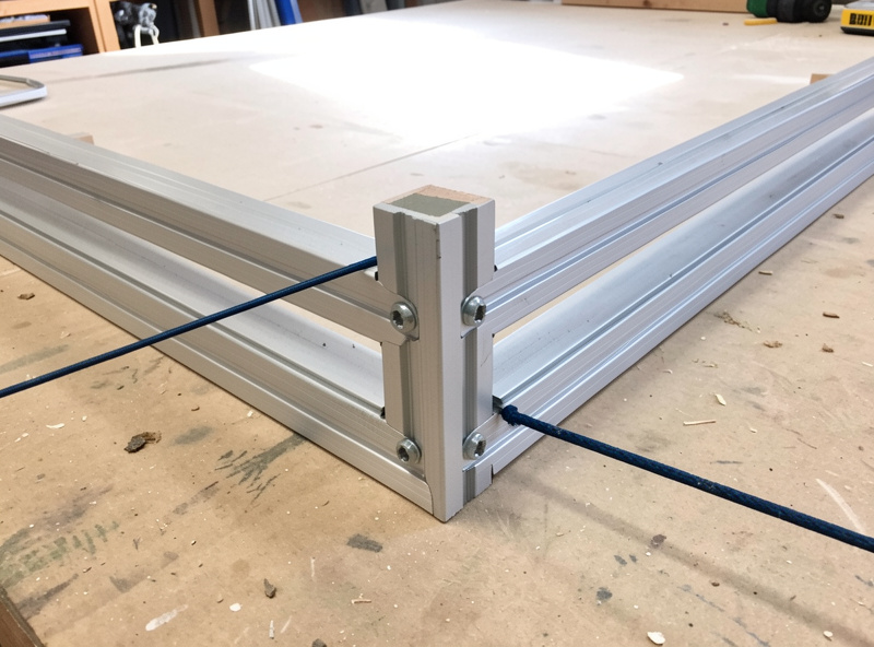 EMT conduit enclosure frame corner showing screen tension and squaring